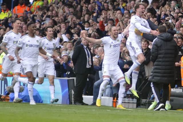 Patrick Bamford runs to the bench to celebrate his goal for Leeds United against Crystal Palace.