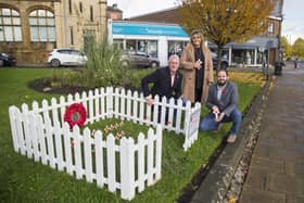 Joshua Adams Menswear shop are giving crosses for donations for the Spenborough Garden of Remembrance in Cleckheaton. From the left: Ray Norris, Joshua Adams Menswear co-owner, Joanne Butterworth and Adam Howden.