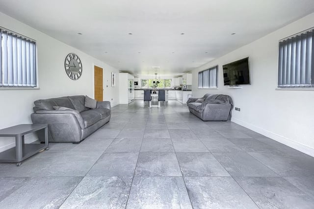 The family seating, or entertaining area within the open plan arrangement.