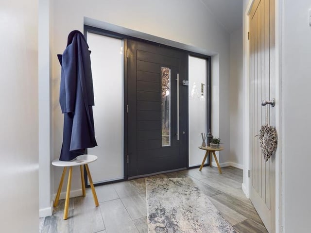 A bright and modern interior is evident from entering the house.