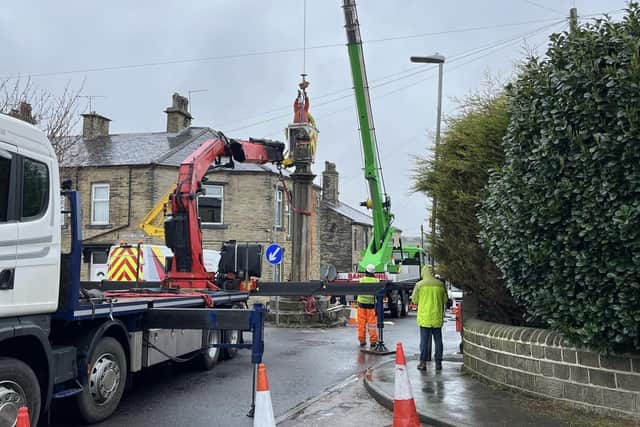 The Oakenshaw Cross being removed in March 2022.
