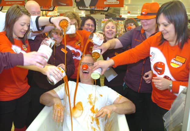 Comic Relief at Sainsbury's Dewsbury in 2009. Pictured is Tim Morris in the bath of beans