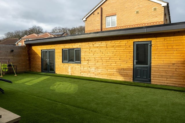 To the rear of the home is a low maintenance garden that has a large patio area and an area of artificial grass - completing the garden space.