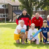 Shaw Cross Community Centre summer holiday activities for kids. Back, from the left, Danny Teale and Shaun Fox from Legacy Sport and Dave Hilton from Shaw Cross Tenants and Residents Association. Front, Matilda Bolton, 11, Chloe Hilton, 15, and Jaxon Senior, 11.