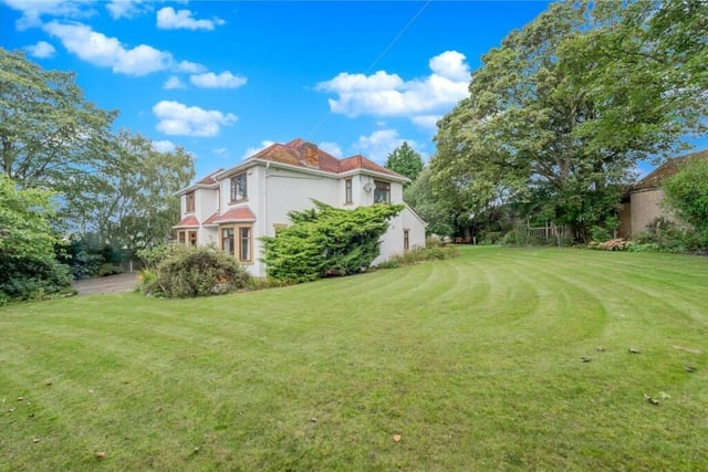 The property is set on a generous plot of approximately 0.43 acres, with fabulous far-reaching views to the rear.