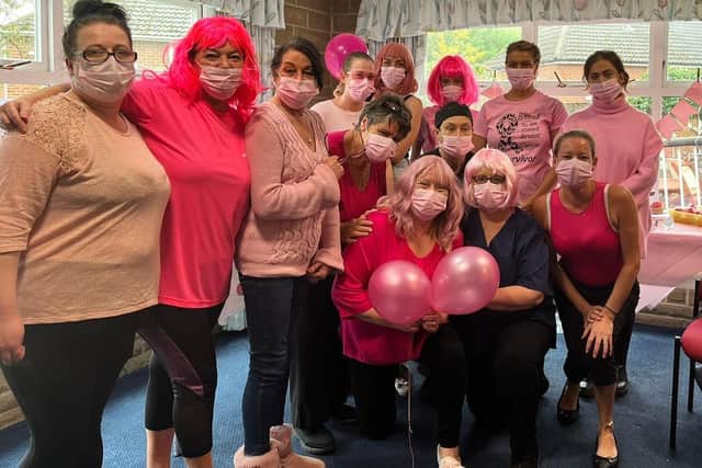 Staff at Ings House Nursing Home in Liversedge hosted a charity to raise money for breast cancer research, organised by Kate Rankin (front right) and Marie Armitage (front left), with manager Carolyn Orman in between.