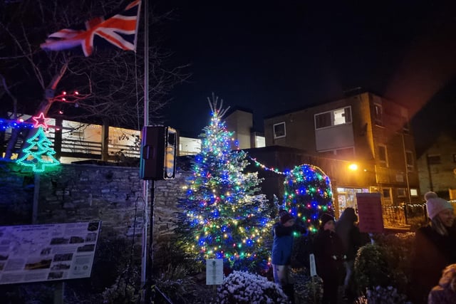 The lit up Christmas tree in the village's Jubilee Garden. The tree was donated by Forest Fresh, based on Far Common Road, Mirfield.