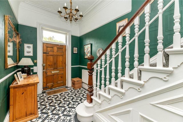 A welcoming hallway with staircase leading up.