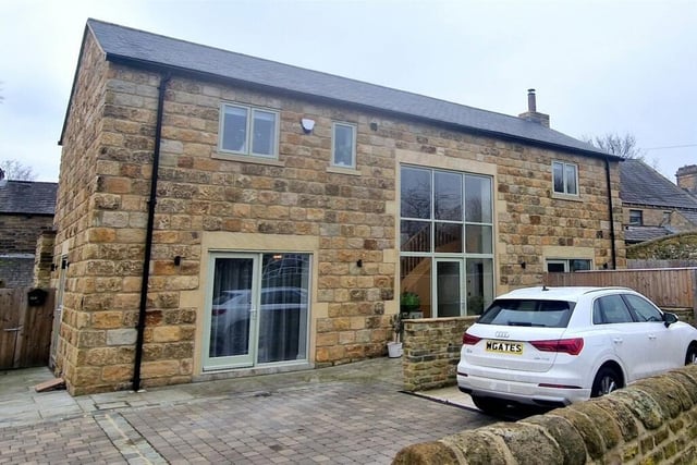 This property on Wellhouse Lane, Mirfield, is on sale with Whitegates priced £465,000