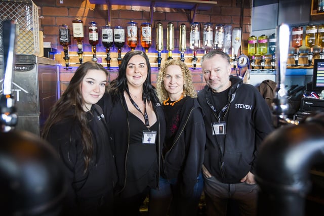 Behind the bar at Rock the Loft II, from the left, Sophie, Dione, Billie and Steven.