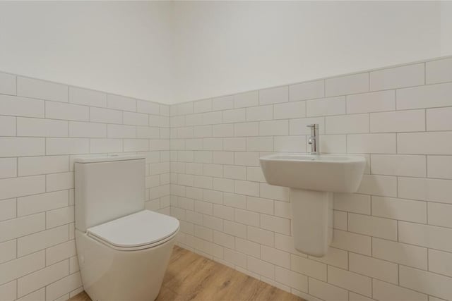 Downstairs has a WC with a wash hand basin and tiled walls.