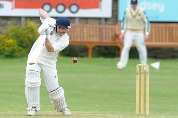 Opener Tim Jackson made an unbeaten century for Woodlands in their crucial win over title rivals New Farnley.