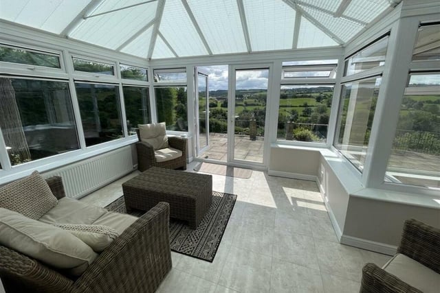 The conservatory takes full advantage of the vista.