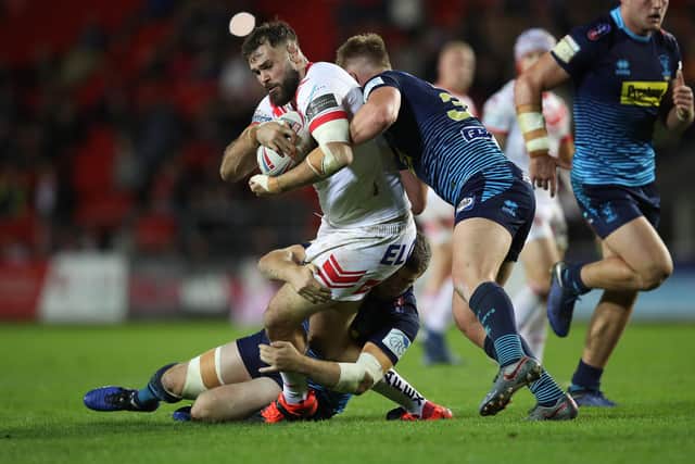Former Dewsbury Celtic star Alex Walmsley in action for St Helens against Wigan Warriors.