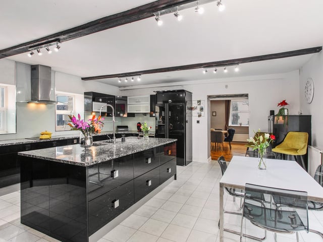 A large central island is a feature of the dining kitchen.