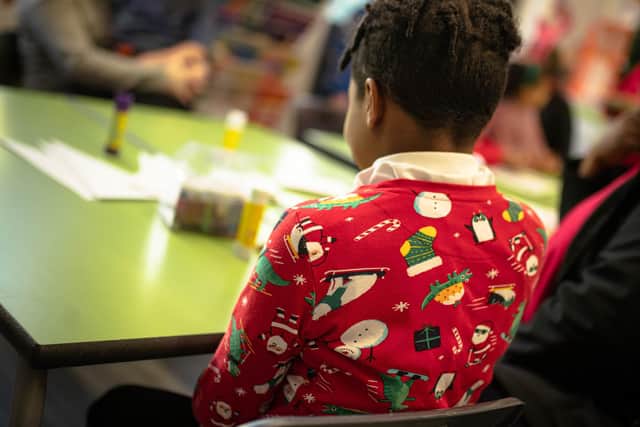 A pupil from Engage Academy in their Christmas jumper.