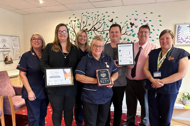 Staff at Holme House Care Home in Gomersal, including Deputy Manager Alison Sowden, front centre, celebrate after successfully meeting the standards in the Kirklees Care Charter Programme 2023.