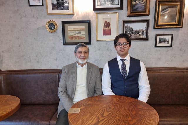 Father of the Legends Café owners, Manzoor Bahadur, with his grandson Mohammed Usmaan.