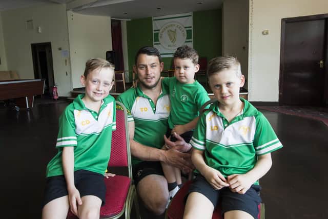 Tommy Dunford with his sons, from the left, Carter, seven, Colby, three, and Logan, six, at Dewsbury Celtic RLFC.