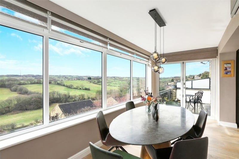 The dining area has double glazed window and bi-folding doors, making the most of the panoramic views, with oak flooring opening to the sun-terrace.