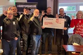 Janet Lonsdale (right) and Ian Thornton (third from left), OLSC members, present the cheque to Stephen Hubbard (second from left), of Andy's Man Club