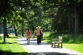 Walkers try to stay cool in the summer heatwave.