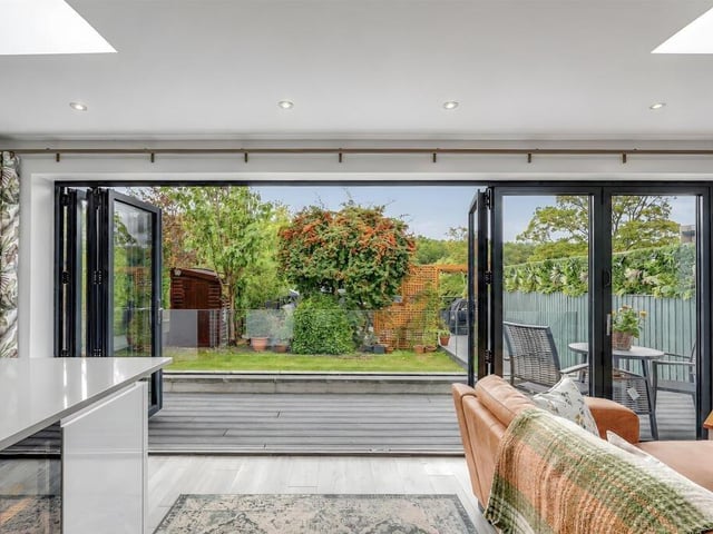 Full-length bi-folding doors open directly onto the garden.