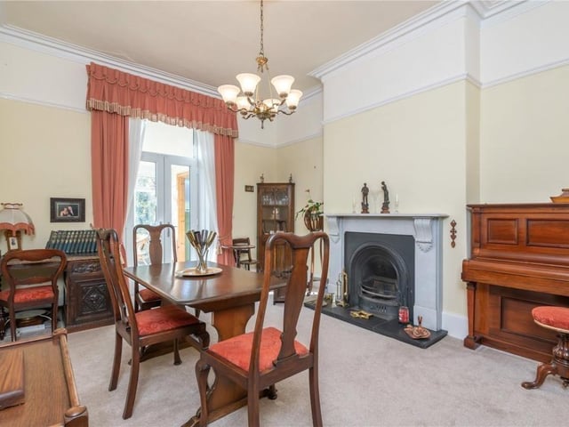 Another room with plenty of space. The dining room has French doors through to a conservatory.