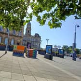 Artwork on stat boxes and new planters in Dewsbury town centre.