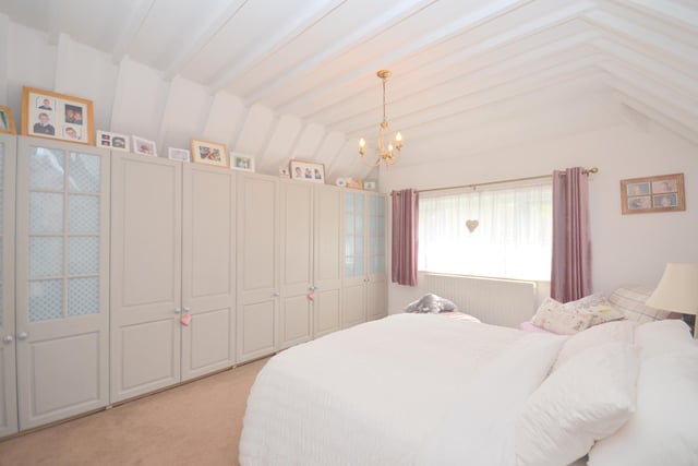 One of four bright and spacious bedrooms.