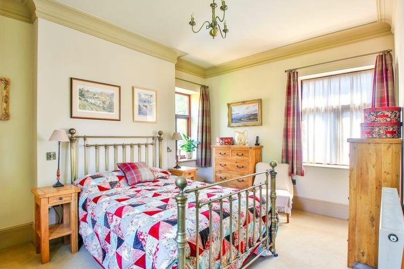 One of the property's spacious bedrooms, two of which have en suite facilities.