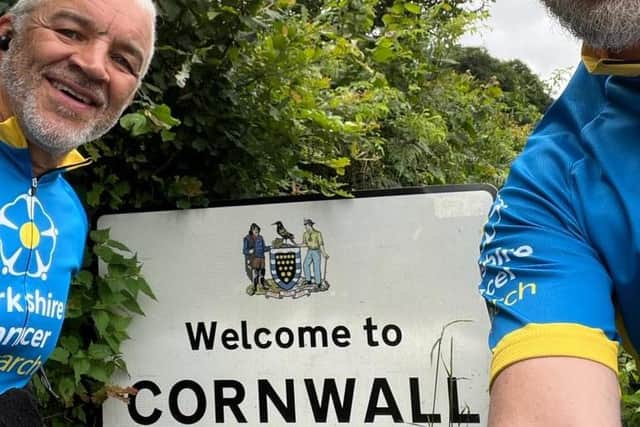 Welcome to Cornwall! Karl Simpson and Andy Walker towards the end of their epic bike ride from Dewsbury to Newquay.