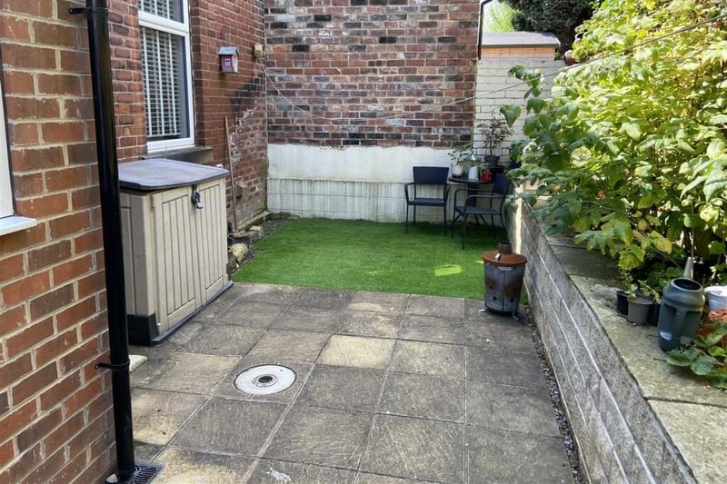 A low maintenance rear garden and seating area.