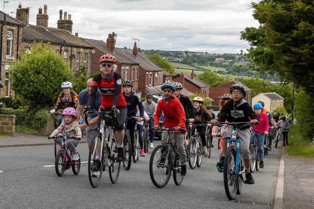 Riders make their way up the Roberttown Lane climb during the 2022 event. (Image: Leeds Media Services)