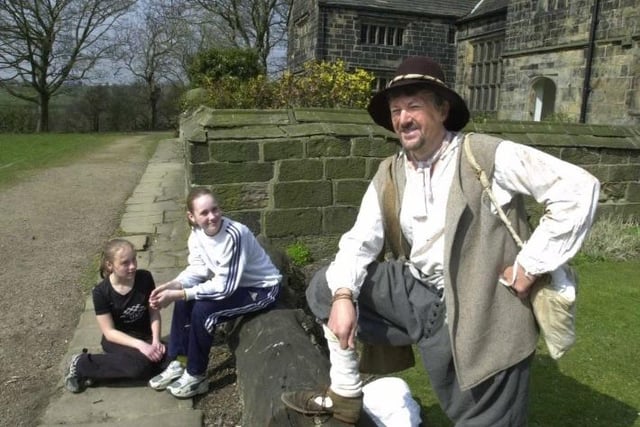Gomersal Middle School pupils Lucy Nield (left) and Hannah Walker, both aged 13, take a close look at Kevin Walker of Dewsbury, who dressed as a 17th century looter for a historic storytelling session at Oakwell Hall, Birstall.