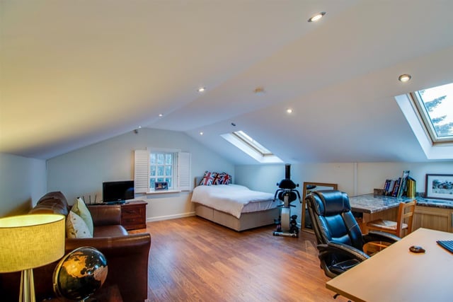 Space for everything in this sizeable room with spotlights and velux window.