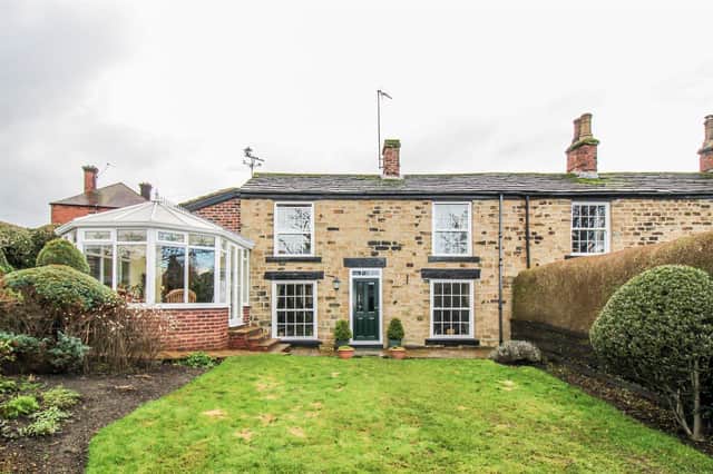 View of the charming cottage with enclosed gardens that's for sale currently in Horbury.
