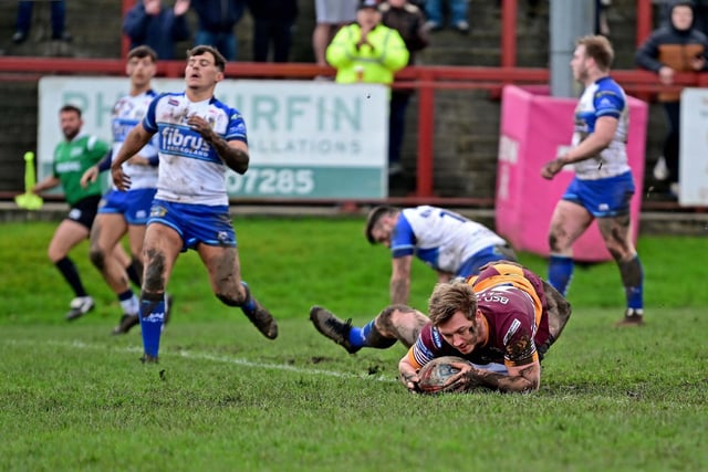 Nyle Flynn goes over for try number seven against Workington in the third round of the Challenge Cup.