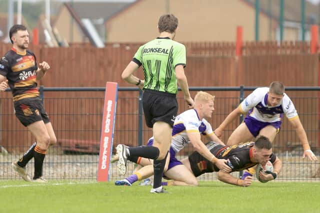 Bailey O'Connor dives over for a try for Dewsbury Rams against Newcastle. Picture: TCF Photography