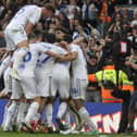 Leeds United players celebrate their dramatic late equaliser against Cardiff City.
