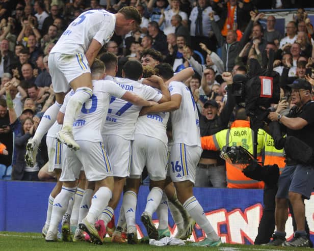 Leeds United players celebrate their dramatic late equaliser against Cardiff City.