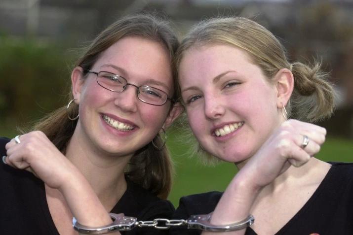 Puils Joanna Townend and Danielle Cook handcuffed together at Howden Clough High School, Dewsbury to raise cash for Children in Need.