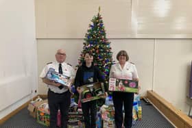 Oscar with his donations for The Salvation Army Christmas Present Appeal. Pictured with Majors Paul and Carolyn Wilson.