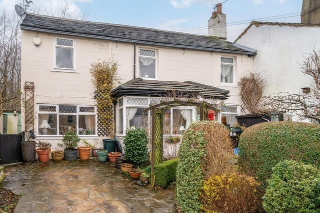 This home on Upper Lane, Little Gomersal, is on sale with Barkers priced £295,000.