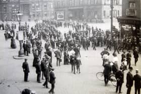 Crowds begin to gather in Market Place, Dewsbury, circa 1910, but what they are coming to see is something of a mystery. There is a banner in the distance. Could it represent the annual miners' union gathering? Whatever the event, most of those pictured would have been employed in the textile industry in some capacity or other, or in some of the industries which supported textiles, like mining and engineering.