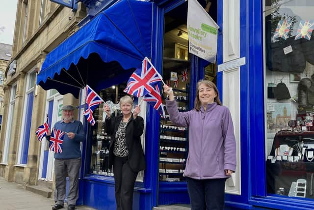From left: Ray Baker, owner, Kim Gott, shop manager and Sue baker, owner, outside Greenwoods on Church Street, Dewsbury.