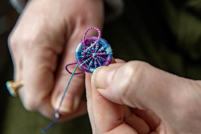 Dorset Button maker Gini Armitage working in her home studio, who has revived the tradition
