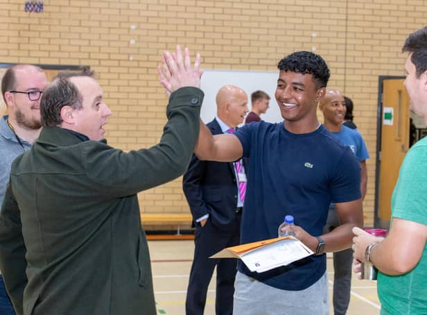Heckmondwike Grammar students collect their results.