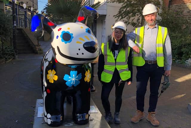 The Kirkwood's 'Day of the Dog' Snowdog art work with staff members from Elland company Illingworth and Gregory, who helped to reinstall the sculpture off Cheapside in Cleckheaton.
