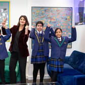 Carlton Junior and Infant School Headteacher Rizwana Ahmed with some of the school's pupils after the school was named among the top three in the country.